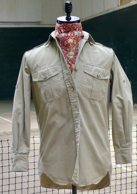 classic Beige shirt on a mannequin with a floral scarf against a blurred background